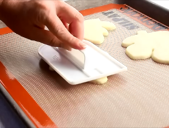 How to Flatten Sugar cookies for a Smooth Decorating Surface by thebearfootbaker.com