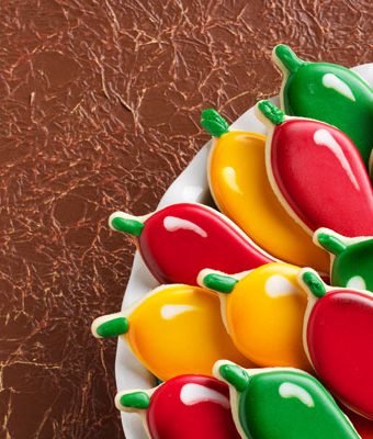 How to Decorate Chili Pepper Cookies with Royal Icing via thebearfootbaker.com
