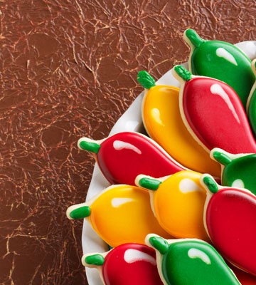 How to Decorate Chili Pepper Cookies with Royal Icing via thebearfootbaker.com