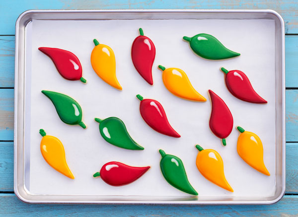 How to Decorate Chili Pepper Cookies with Royal Icing via www.thebearfootbaker.com